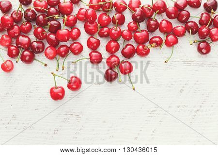 Fresh cherries. Freshly picked sweet cherries on wooden table