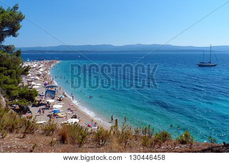 The clear blue waters of stunning Zlatni Rat Beach in Croatia