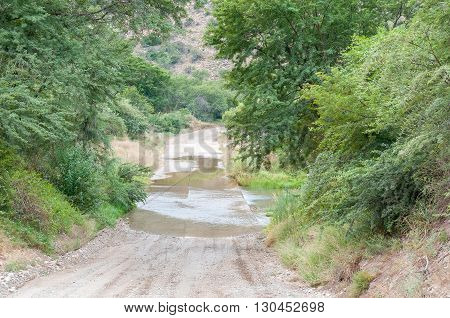 The road through the Baviaanskloof (baboon valley) crosses the Baviaans River on a concrete causeway one of many such crossings on the road