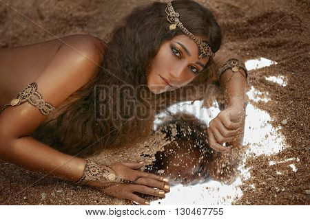 Attractive young tribal woman in ethnic jewelry