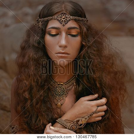 Attractive young tribal woman in ethnic jewelry