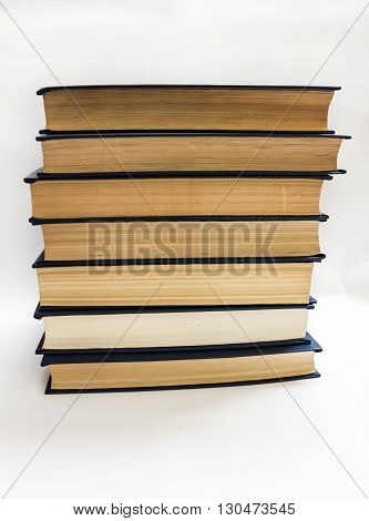 Pile of various books on a table