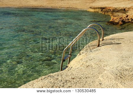 landscape from the sea with stairs to the shore background