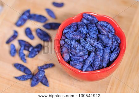 Fresh ripe honeysuckle berries in a bowl