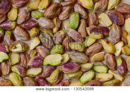 Green pistachio nuts without shell in a wooden box