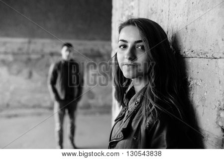 handsome guy and beautiful girl posing in a bystreet
