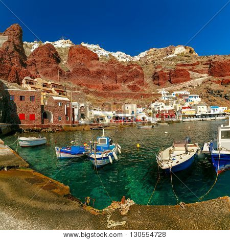 Fishing boats at Old port Amoudi of Oia village at Santorini island in Aegean sea, Greece