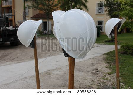 a picture of a groundbreaking and hats
