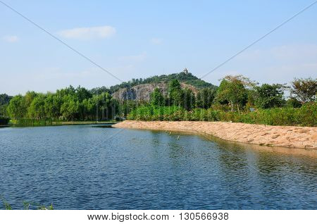 A manmade lake and rose garden within Chenshan Botanical Garden in Songjiang district Shanghai China.