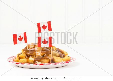 A plate of poutine a unique dish that originated from the province of Quebec.