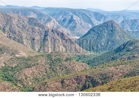 The view towards the east from the Holgat Pass in the Baviaanskloof (baboon valley). The road is visible in the valley down below