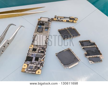 Repairing Smart Phone on Desk Selective Focus