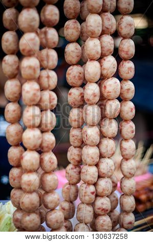 Fresh raw Issan sausage Sai Klok. Traditional thai cuisine.