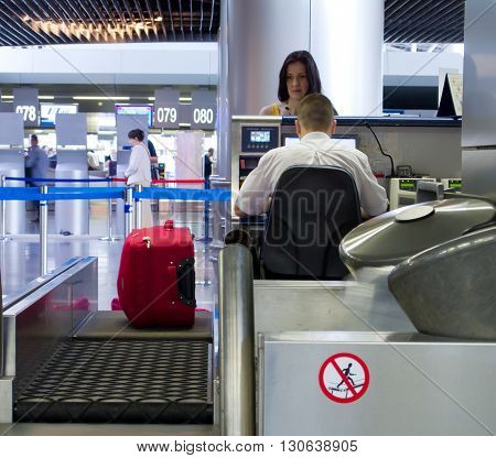 MOSKOW, Russia  May 18 2013, Passenger standing at the front desk for the flight, Moskow