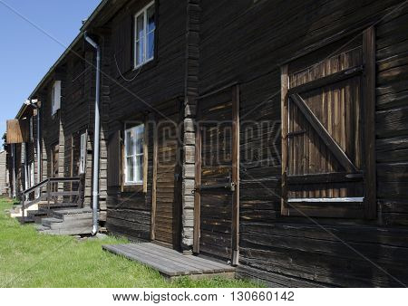 Street wid old timbered house in line from the North of Sweden.
