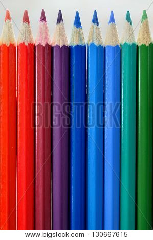 Color pencil palette composition on gray background