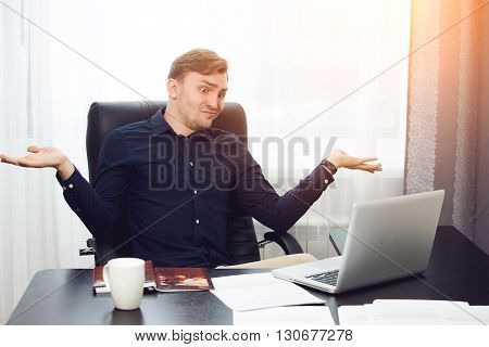 dumbfounded business man throwing his hands up.
