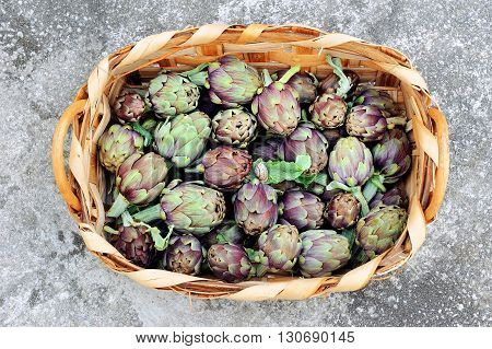 fresh artichokes in wicker basket from the top