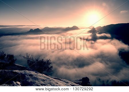 Fantastic Dreamy Sunrise On The Top Of The Rocky Mountain With The View Into Misty Valley