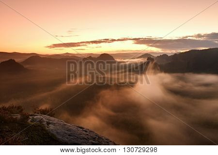 Fantastic Dreamy Sunrise On The Top Of The Rocky Mountain With The View Into Misty Valley