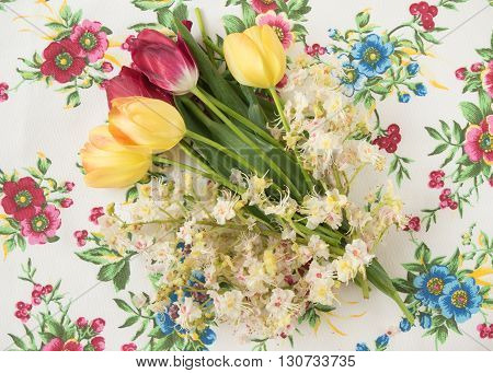 Flowers Tulips And Chestnuts On A Beautiful Table