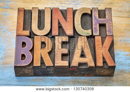 lunch break banner - text in vintage letterpress wood type printing blocks against grunge painted wood