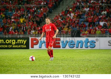 July 24, 2015- Shah Alam, Malaysia: Liverpool's James Milner dribbles the ball in a friendly match against the Malaysian Team. Liverpool Football Club from England is on an Asia tour.