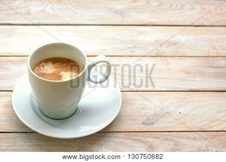 Espresso In The Cup On The Wooden Background
