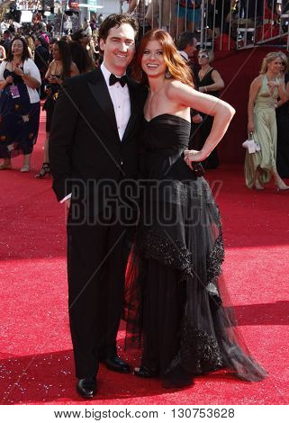 Daniel Zelman and Debra Messing at the 60th Primetime Emmy Awards held at the Nokia Theater in Los Angeles, USA on September 21, 2008.