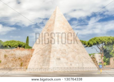 Defocused Background With Pyramid Of Cestius, Iconic Landmark In Rome