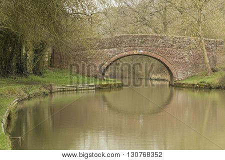 An image showing an old bridge over the Grand Union Canal shot at Laughton Hills Leicestershire England UK.