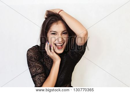Beautiful girl shouts isolated on white background