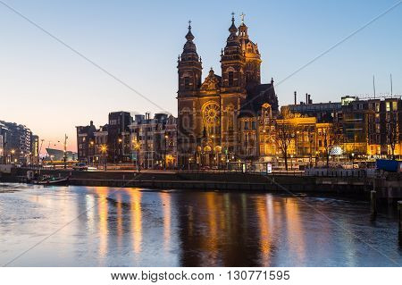 AMSTERDAM NETHERLANDS - 17TH FEBRUARY 2016: A view towards the Church of Saint Nicholas in Amsterdam in the morning.