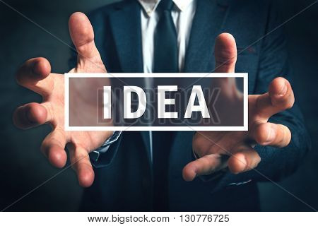 Businessman grabbing new idea with his hands selective focus