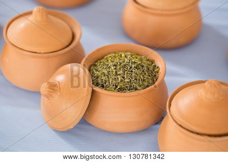 Clay Pot And Herb On White Table