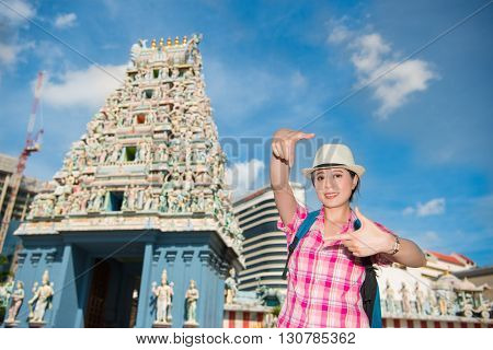 Happy Young Woman Framing In Sri Mariamman Temple, Singapore