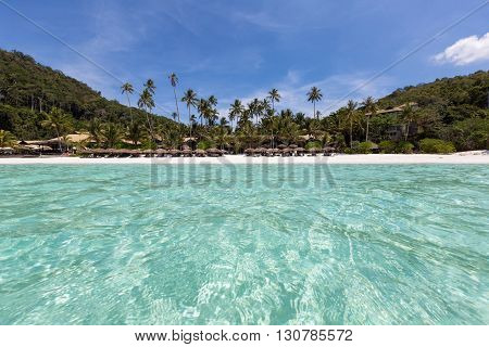View from the turquoise waters to the beach on Pulau Redang, Malaysia