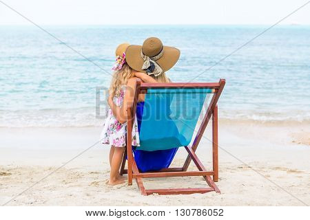 Cute Girl And Beautiful Mother On The Beach