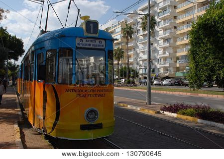 ANTALYA/TURKEY-OCTOBER 18: City tramway on the rail with Antalya International Golden Orange Logo.October 18, 2014-Antalya/Turkey