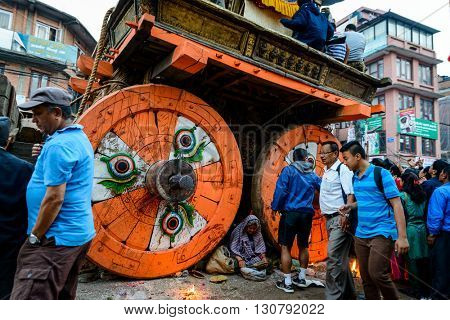 PATAN, NEPAL - MAY 19, 2016: God of rain Rato Machhindranath chariot festival. Rato Machhindranath is worshiped as the god of rain. The chariot is pulled through the street of Patan for about a month.