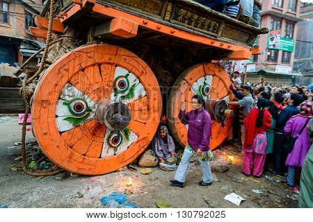 PATAN, NEPAL - MAY 19, 2016: God of rain Rato Machhindranath chariot festival. Rato Machhindranath is worshiped as the god of rain. The chariot is pulled through the street of Patan for about a month.