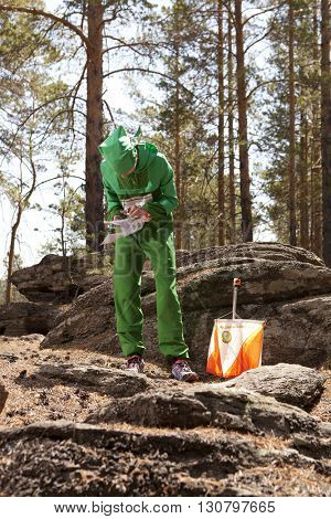 RUSSIA, ULAN-UDE - MAY 22, 2016: Russian Azimut - 2016. Orienteering competition is held annually in the Buryatia region. People at at control point at orienteering course.