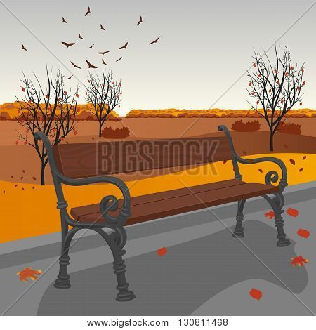Empty wooden bench in the city park in autumn