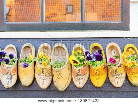 Traditional dutch shoes clogs with fresh flowers