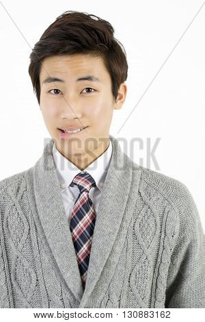 Asian young man biting his lips isolated on white background