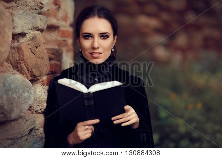 Beautiful Dark Princess Reading a Book Outside