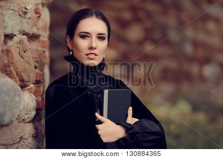Beautiful Dark Princess Reading a Book Outside