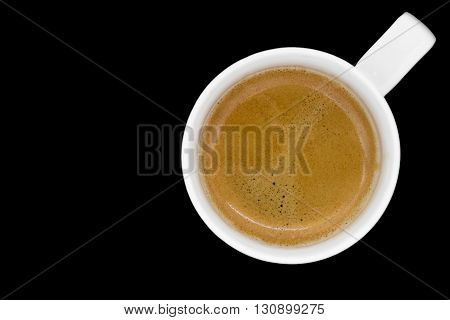 Cup of fresh espresso on black background view from above with clipping path and copyspace.