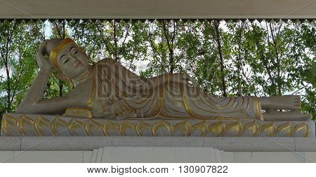 reclining buddha statue in mendut buddhist monastery