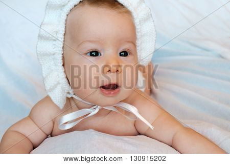 an innocent baby on a white background